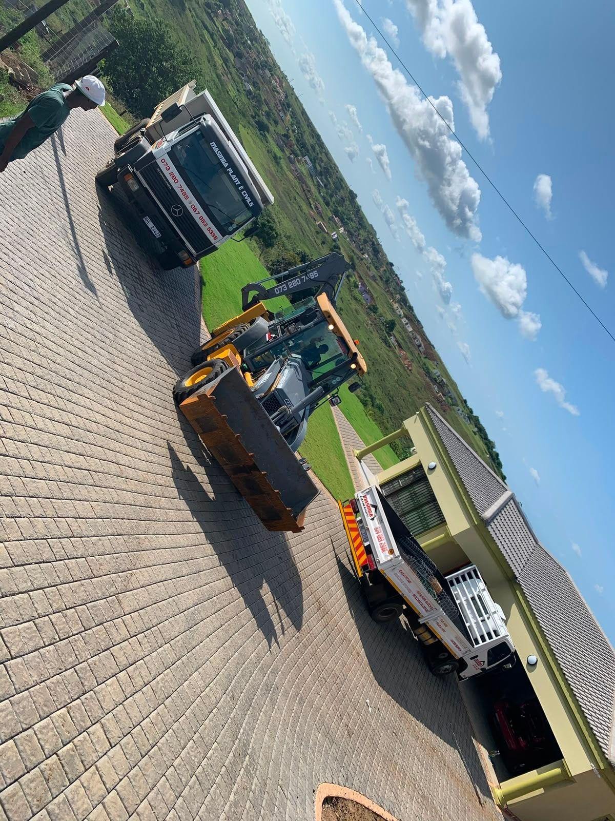 Masinga Plant & Civils branded truck and TLB fleet on site