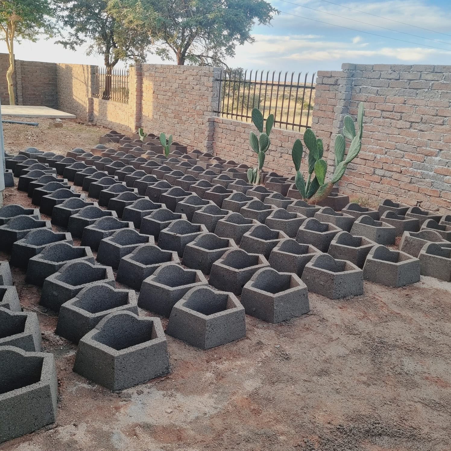 Grey interlocking retainer blocks laid out ready for delivery