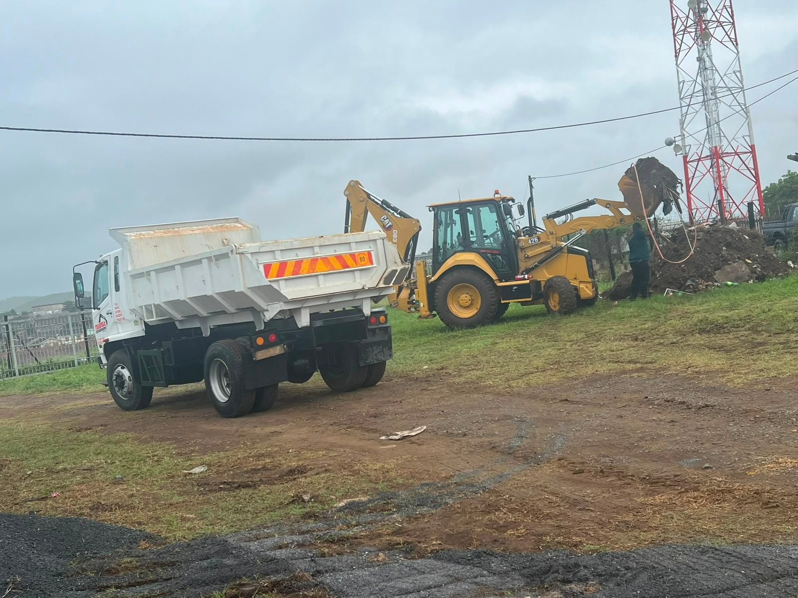 CAT TLB and dump truck excavating on a Northern KZN construction site